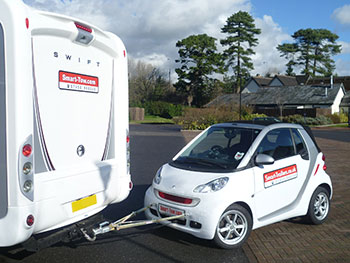motorhome with car in tow